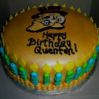 Wake Forest Birthday Cake Red Velvet Cake with cream cheese frosting filling, covered with MMF. Demon Deacon and writing are made with royal icing. Candles and...