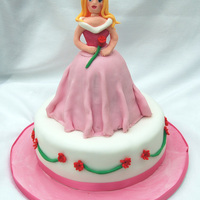 Princess Cake A cake made for my "princess mad" daughter. I cannot bear the plastic dolls being used in these cakes, so I made the princess