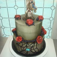 25Th Hallowversary Cake 10 inch double layer carrot cake on bottow with an 8 in double red velvet on top. Airbrushed to match topper. All Buttercream decorations...