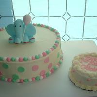 Fondant Elephant First Birthday Cake This is a 12 inch torte iced in bc with fondant accents with matching smash cake. Elephant was handmade with fondant