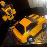 Bumblebee Transformers Chocolate & vanilla cake, with chocolate filling, covered on fondant. Bumblebee was made of gum paste and rice crispies. TFL.
