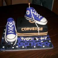 Purple Chucks This cake was made for my sister's birthday. The shoes are made of rice crispies and fondant. the cake was vanilla and strawberry...