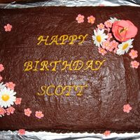 Flower Birthday Cake This was just a basic chocolate cake with buttercream icing. The flowers are made out of gum paste. This was the 1st time I worked with gum...