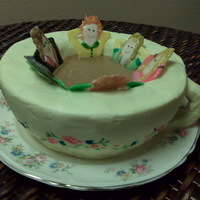 Tea Party This cake was made for a tea party birthday. Hand shaped tea cup with friends warmed by the tea.