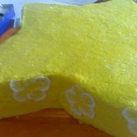 Birthday Star yellow star shaped cake with hand painted white flowers