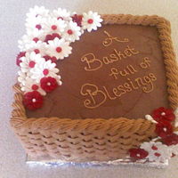 Basket Full Of Blessings This is a square baket weave chocolate cake with daisies.