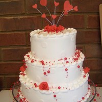 Valentine's Wedding Cake Buttercream Icing. Roses and Hearts are made of gumpaste. Bought the crystals from Hobby Lobby.