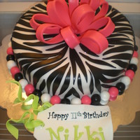 Zebra Print Cake Chocolate Fudge Cake with Chocolate Fudge Filling. Fondant accents.