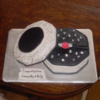Engagement Ring Box The top and bottom is all cake covered with fondant, handpainted with silver luster dust and accented with edible pearls. The ring and...