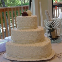 Hearts And Swirls Heart shaped buttercreme with swirls topped with bride and groom strawberries