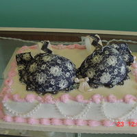 Fancy Bra This cake is buttercreme but the bra is gumpaste with a lace overlay of royal icing.
