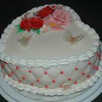 Valentines Heart Fondant covered red velvet cake with fondant flowers and buttercream trims