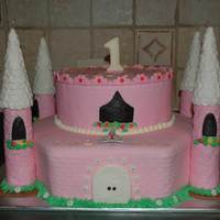 Castle Cake Two, two layer cakes. Turrets are rice krispie treats. Everything covered in fondant. Imprinted with brick embosser. Gems made with melted...