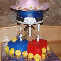 Texas Bridal Shower Texas themed bridal shower. Bottom cake French Vanilla w/BC, top one choc cake w/whipped ganache covered in MMF. Gumpaste details