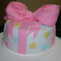 Pink Bow Cake My first fondant cake. A huge pink bow with multicoloured stars.