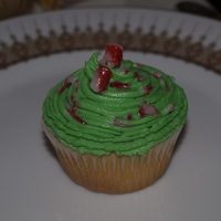 Peppermint Candy Cane Cupcake cupcake with green peppermint flavoured buttercream swirl topped with candy can shards