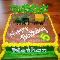 Tractor Cake A friend of mine wanted a birthday cake for her son who LOVES John Deere. Chocolae cake with buttercreme frosting. Corn and cabbage/lettuce...