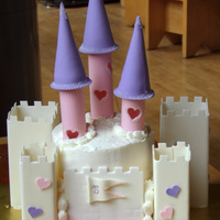 Princess Castle Cake Chocolate Cake with strawberry American Buttercream. Bottom tier is 9 by 6 1/2 inches rectangular (mostly hidden), and top tier is 6-inch...