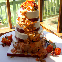 Autumn Leaves Apple Spice Cake with homemade applesauce filling, and Dulce de Leche Italian Meringue Buttercream. Leaves and wedding bands are marzipan....