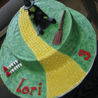 Wicked Witch Of The West Cake Made for my 3 year old niece who loves the wicked witch more than Dorothy! Also made "melting witch" cupcakes