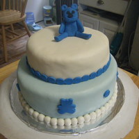 Teddy Bear Cake Cake I made for my brother-in-law who is a big teddy bear, hence the theme. The bear is made out of fondant. Cake is covered in fondant as...