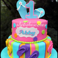 Flop Flop 1St Birthday Cake This was such a fun cake to make! 1st Birthday party was flip-flop themed, with bright colors...pink, aqua, orange, etc. There was also a...