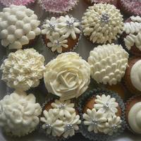 First Cupcakes. Hubby got me a little piping set for Christmas, this was the first chance I've had to have a play. Fun! My first rose was hexagonal,...