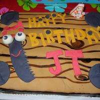 Handy Manny Boys Birthday Cake Chocolate pudding cake with buttercream filling, covered in MMF. I used a coloring book as a pattern for the characters.