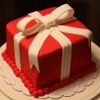 Red Present Cake 8" cake covered in fondant with a fondant bow.