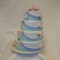 Wedding Cake All sugar flowers, with fondant swags and borders.