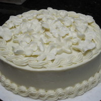 White Blossom Cake red velvet cake with cream cheese frosting. decorated with white apple blossoms on top. This cake is a tribute to my oldest sister. She had...