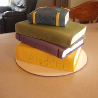 Stack Of Books This cake is the equivalant of a quarter sheet cake plus about half of a 9" round that I cut into 4 rectangles. It is frosted with...
