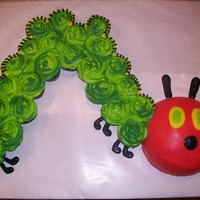 The Hungry Caterpillar Head is a cake and the body is cupcakes.