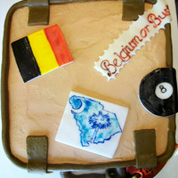 Bon Voyage/ Brithday Cake chocolate cake with a caramel mousse and chocolate caramel IMB, all fondant details and hand painted travel stickers.