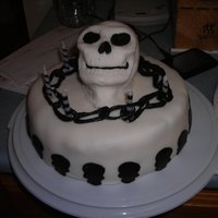 Skull Head Skull head is solid fondant (stupid), i know better now. Baby skull heads all black fondant and chain was constructed from fondant. Cake is...