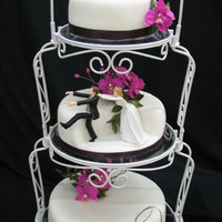 White, Fuschia And Purple Wedding Cake The bride wanted both the topper and the stand to be used for this cake... She didn't account for the fact that the topper would not...