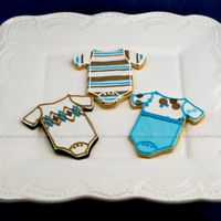 Baby Boy Chocolate & Vanilla Sugar Cookies with Fondant & Royal Icing accents... Stripes are extruded from Sugar Gun and rolled to 1/8&quot...