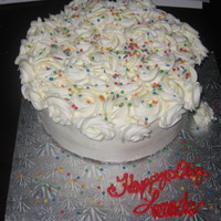 Party Fun White Cake with White buttercream rosettes and party sprinkles. TYFL!