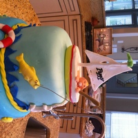 Ocean Theme Baby Shower Cake Fondant three tiered cake. I used chocolate/candy molds for the sea creatures and boat, but I used fondant instead of chocolate for all the...