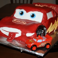 Lightning Mcqueen Lightning McQueen cake for my son's 3rd Birthday (the red fondant was not fun). Carved the shape out of 1 - 9x13 vanilla pound cake, 1...