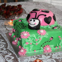 1St Birthday Lady Bug Lemon Pound cake, layered with lemon mousse, butter cream and fondant icing.