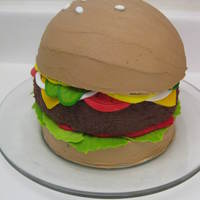 Cheeseburger Cake 3 layers of dark chocolate fudge cake - all 6" pans. The top layer was baked in the Wilton ball pan for the rounded top bun. Iced in...