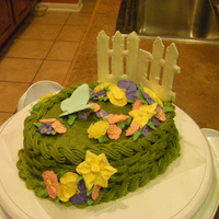 Wilton Course 2 - Basketweave Final cake for Wilton Course 2. Made with green tea icing and a mango flavored cake. The cake sweated a lot and so most of my flowers are...