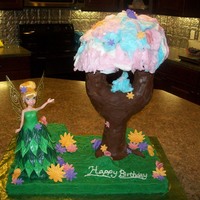 Tinkerbell Pixie Hollow I made this cake for my daughters 4th birthday. The pixie dust tree is made out of pvc pipe, RKT, chocolate fondant, cake, and cotton candy...