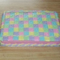 Baby Quilt Cake 9x13 white cake with MMF quilt squares. I used rubber stamps to imprint each of the squares.