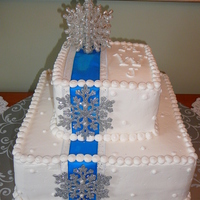 Winter Wedding This is all buttercream with plastic snowflae accents