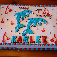 Dolphins And Cherries This was done for a little girl who loves dolphins and cherries and wanted them both on her cake!