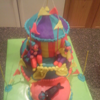 Gilry Bigtop Circus Cake 2nd attempt at building a cake. For a little girl's birthday. Homemade butttercream fondant, boxed yellow cake, settling occurred. 14...