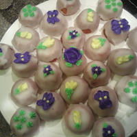 Springtime Petit Fours These are my very first attempt at poured fondant petit fours, with raspberry crumb coat. VERY tasty, but not so pretty, LOL! Big hit...