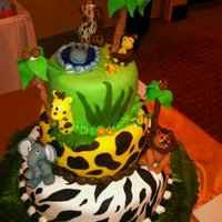 Safari Cake Made this for my Godson's 2nd birthday. Took ideas from Michellekayyy and Boloantiano. Was tired when I made the trees. Used candies...